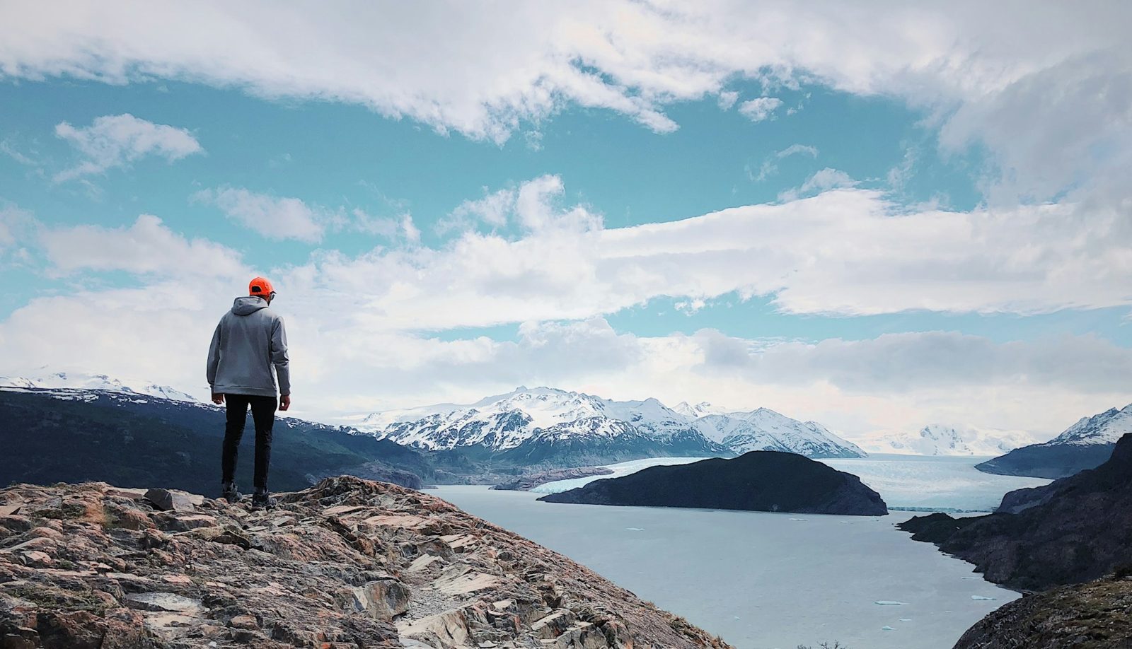 A hiker looks at Grey Glacier from a viewpoint in Torres del Paine